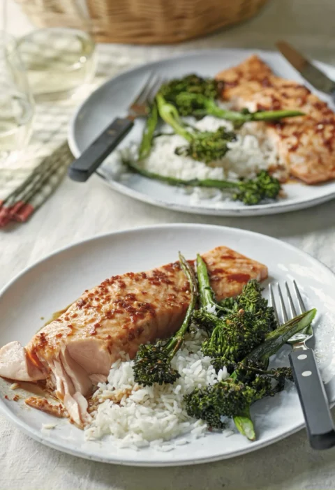 Ina Garten salmon teriyaki and broccolini on a plate with sticky soy maple ginger glaze and steamed basmati rice