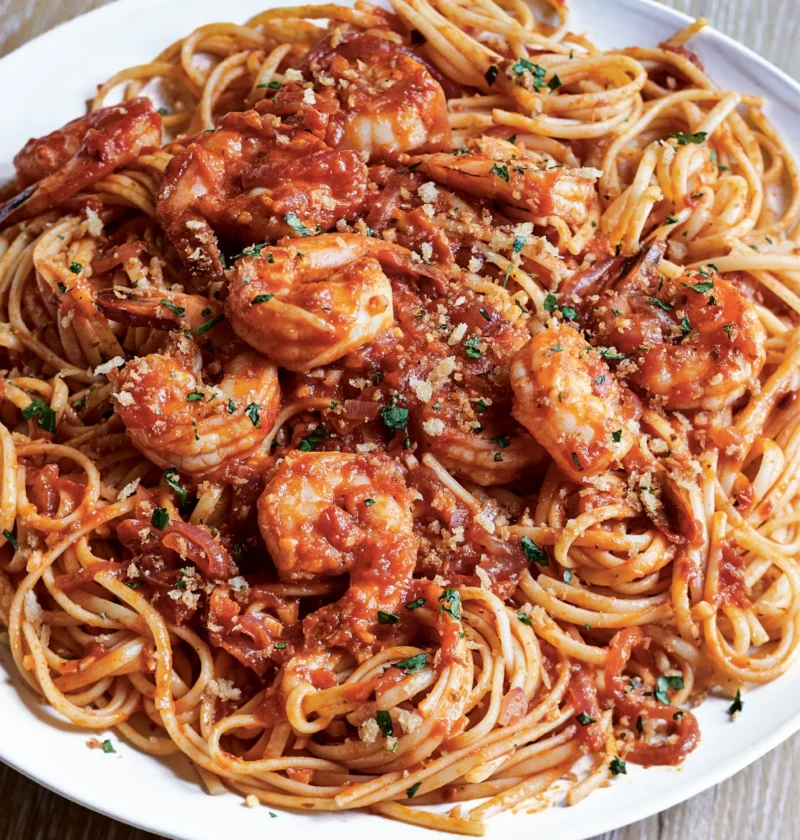 Ina Garten shrimp and linguine fra diavolo topped with toasted panko breadcrumbs in a white serving bowl