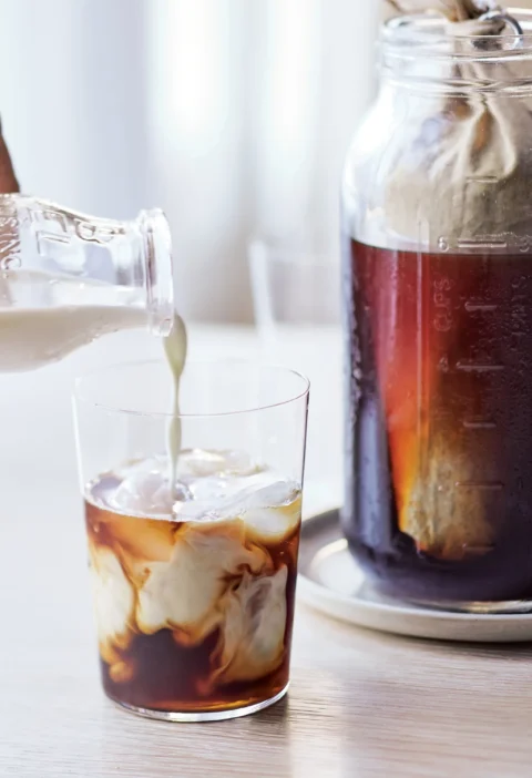 Glass of vanilla cold-brewed iced coffee with milk served over ice, an ina garten vanilla cold-brewed iced coffee recipe