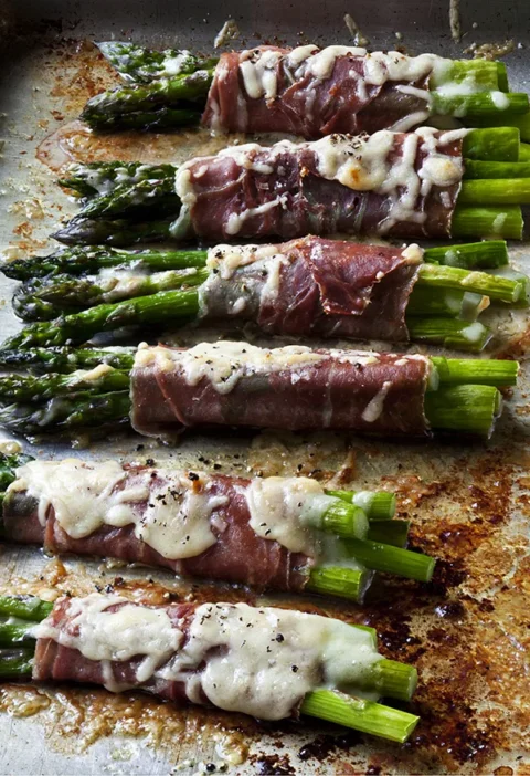 Ina Garten asparagus & prosciutto bundles baked with melted Gruyère on a sheet pan