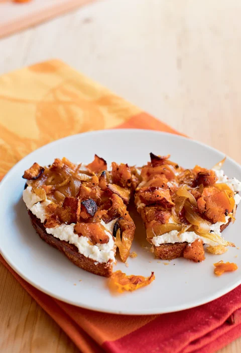Ina Garten butternut squash and ricotta bruschettas topped with caramelized onions on toasted bread