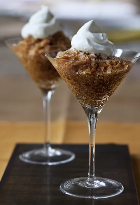 Ina Garten coffee granita served in two martini glasses, topped with whipped cream