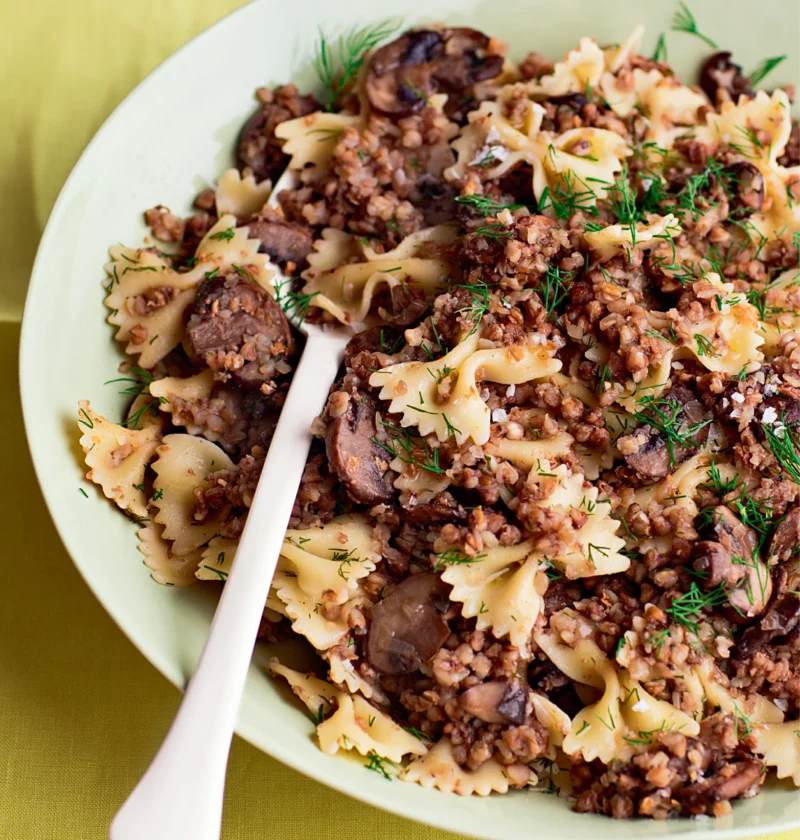 Ina Garten kasha varnishkes with wild mushrooms, bow-tie pasta and fresh dill in a pale green bowl
