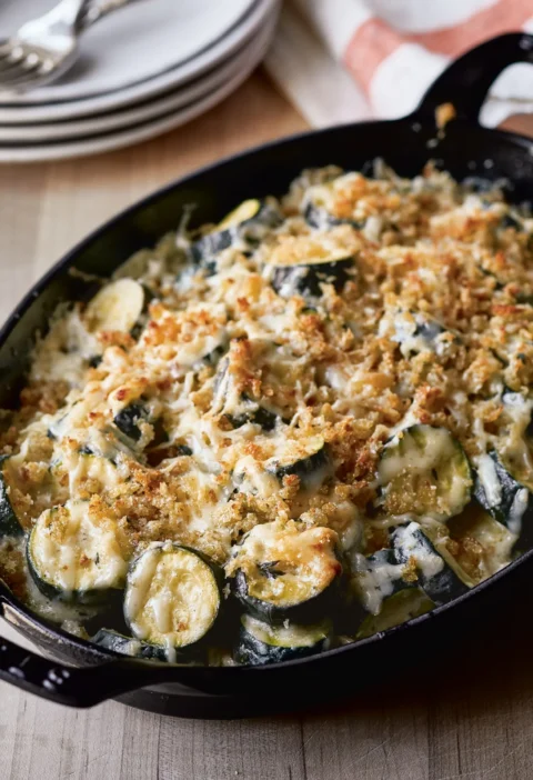 Ina Garten Provençal zucchini gratin with a golden bread crumb and Gruyère crust in a black cast iron gratin dish