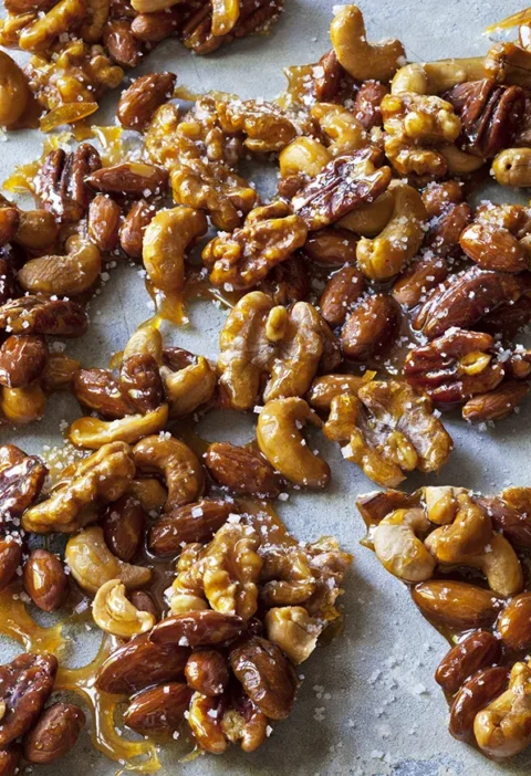 Ina Garten salted caramel nuts, clusters of cashews, pecans and walnuts coated in golden caramel with flaky salt